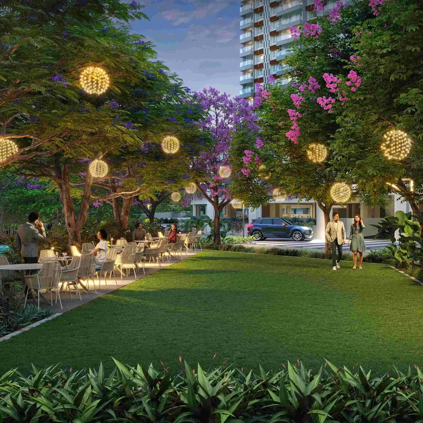 The grand party lawn with lanterns in the trees beside the pool